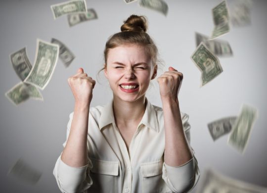 money-raining-on-woman-celebrating